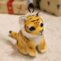 Cute stuffed tiger plush keychain with yellow stripes and soft fur on a cozy background - Brown Tiger / 15CM
