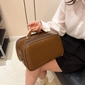 Portable brown faux leather makeup bag with large capacity and sturdy top handle - Brown