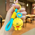 Detail of yellow puppy keychain with lemon hat, blue woven strap and ice cube charm - Yellow Lemon Headgear Dog