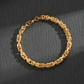 Golden Byzantine chain bracelet in stainless steel presented on a dark slate background - Byzantine Chain / Gold