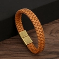 Macro shot of brown braided leather bracelet with vintage bronze magnetic clasp detail - Retro Natural