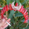Detail of red raw crystal crown with silver wire wrap and hollow moon ornament - Orange Red