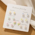 7-day rose stud earring set with pearlescent finish on a white display card - Rose Flower Weekly Stud Earrings Set (E0051-1)