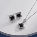 Macro detail of silver necklace and earrings set with square black gems and zircon halo - Silver Square Black (HQ0001(27）)