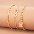 Close-up of golden zircon bracelet set with butterfly pendant and infinity symbol - KC Gold Butterfly Style (2789)