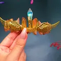 Detailed shot of handmade golden wing crown with vibrant crystal clusters and aurora stones - Milk Tea Crystal + Gold Wing Moon