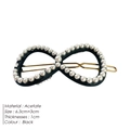 Elegant black infinity-shaped acetate hair clip with pearl embellishments and gold metal - Black