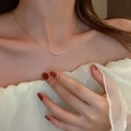Detail of elegant minimalist pearl necklace on neck showcasing golden chain and pearls - 26# Necklace-Gold Geometric Pearl