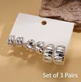 Three-pair silver C-shaped textured geometric metal stud earrings set on a white card - Silver Set (3 Pairs)