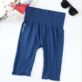 High-waisted seamless blue yoga shorts featuring a wide elastic compression waistband - One Size / Blue