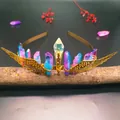 Macro detail of bridal crown with purple crystals and gold wings on a wood log - Pink Blue Crystal + Gold Wings