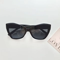 Klassische schwarze Cat-Eye-Sonnenbrille mit dickem Retro-Rahmen und UV-Schutzgläsern - Schwarz