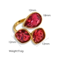 14K gold plated titanium ring with pear and square red crystals in an open band design - Red