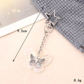 Macro shot of resin butterfly keychain with silver star clasp, 9.5cm length and 8.6g weight - Small Pendant / AB Color Butterfly Star Clasp Charm(K4607)