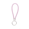 Close-up of pink rhinestone keychain with sparkling crystals and silver metal ring - Pink