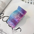 Macro shot of large blue and purple gradient hair claw clip with golden glitter finish - Starry Pink Blue