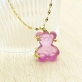 Detail of purple matte bear pendant with golden stars on a fine water wave chain - Purple Lip Chain