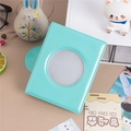 Detail of mint green 3-inch photo album with a circular hollow window for polaroid cards - Mint Green Round