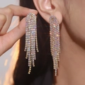 Luxurious long gold tassel earrings with colorful rhinestones on female model - Flat Style / Gold AB Rhinestone