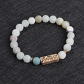 Lava stone bead bracelet in light blue and grey with Energetic engraved metal bead - Energetic Engraved Plate (G1147-3)