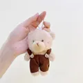 Close-up of plush bear charm wearing corduroy overalls with cute bear head buttons - Brown Bear Dark Brown Pants Silver Chain