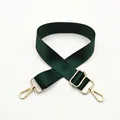 Detail of dark green nylon strap with textured weave and gold-tone metal hooks - Gold Buckle / Green