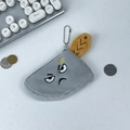 Close-up of a clever plush meat cleaver coin purse with funny facial embroidery - Menacing Fierce Expression