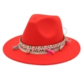 Detail of red wool fedora with bohemian shell charms and colorful tassel trim - Orange Red