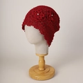 Close-up of red crochet beanie featuring hollow knit patterns and white pearl accents - M (56-58cm) / Red