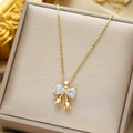 Collana in acciaio al titanio dorato con ciondolo a fiocco e zirconi a forma di cuore - Fiocco Tulipano / Oro