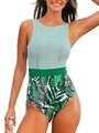 Detailed view of the striped and tropical leaf print pattern on a women's one-piece swimsuit - S / Green Stripes + Green Flowers