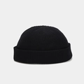 Classic black corduroy docker hat with a ribbed texture and retro brimless roll-edge design - Adjustable / Black