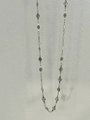 Macro view of silver geometric diamond plates on a long tassel belly chain necklace - Rhombus Style / Silver