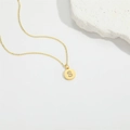 Minimalist gold necklace with a round S-letter pendant inlaid with cubic zirconia - Letter S
