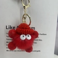 Cute red plush monster keychain with fluffy fur, white eyes and a gold lobster clasp - Red