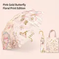 Pink foldable UV umbrella with butterfly floral patterns and matching carry bag - Standard Foldable Gold Pole Curved Handle Butterfly And Carrying Bag