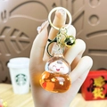 Leuke oranje beer sleutelhanger met sterren glitters, gouden sluiting en klein belletje - Kalebas-Oranje