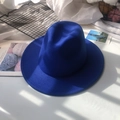 Flat lay of royal blue wool fedora hat on white fabric with artistic shadow patterns - M (56-58cm) / Sapphire Blue