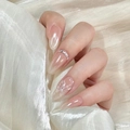 Close-up of nude pink gradient oval nails with white floral art and rhinestones details - By1607 Longingly Awaits / Glue Type