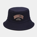 Detailed view of red Brooklyn 1898 embroidery on a navy cotton canvas bucket hat - M (56-58cm) / Navy Blue