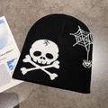 Detailed flat lay of black knit beanie with white skull and spider web patterns - M (55-59cm) / Black + White Skull