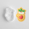 Glove-shaped Christmas cookie mold with heart pattern and decorated icing biscuit - Christmas Mittens