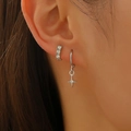 Sparkly cross charm hoop earrings set with shimmering zircon accents on ear - Silver Style