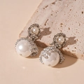 Macro detail of silver mesh earrings with pearls and shimmering pave-set rhinestones - Silver Rhinestone Mesh Pearl Style (WE1957)