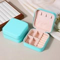 Light blue PU leather portable jewelry box with pink lining and secure zipper closure - Teal Blue