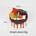 10cm realistic PU mousse cake toy with chocolate drizzle and colorful fruit toppings - Brown