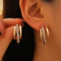 French style gold C-shaped geometric earrings with rhinestones shown on model - KC Gold Tone Multilayer Zirconia Style (12003)