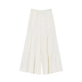 Detailed flat lay of beige tiered wide-leg pants with elastic waist and ruffle layers - S / White Pants