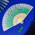 Bamboo folding fan with white to green gradient, cherry blossoms and green tassel - White Green Gradient Cherry Blossom