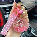 Pink shell unicorn liquid keychain with Happy Moments wrist strap and golden ring - Pink-Shell Unicorn
